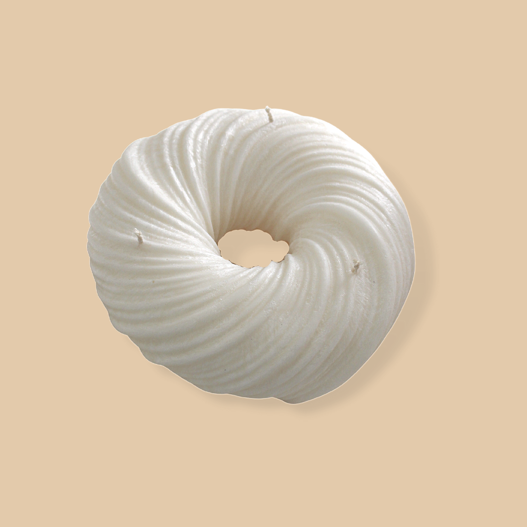 Sculptural round and curvy Lola candle in Ivory (white) colour.