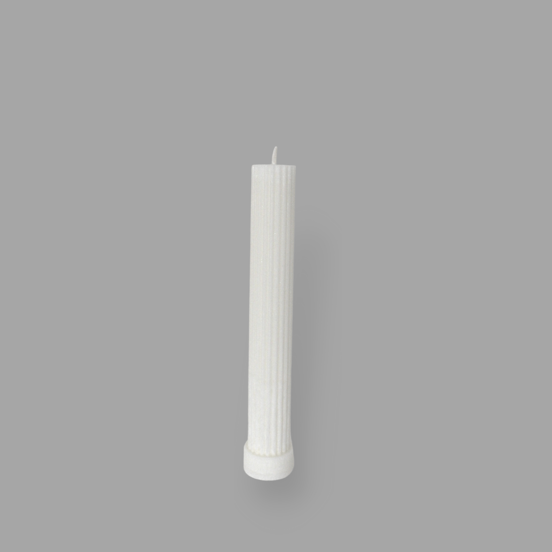 Allegra fluted pillar candle in 20cm height and flat base shown in ivory (white) colour. 