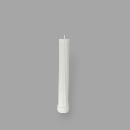 Allegra fluted pillar candle in 20cm height and flat base shown in ivory (white) colour. 