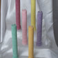 Allegra fluted pillar candle with flat base shown in all six bright pastel colours.