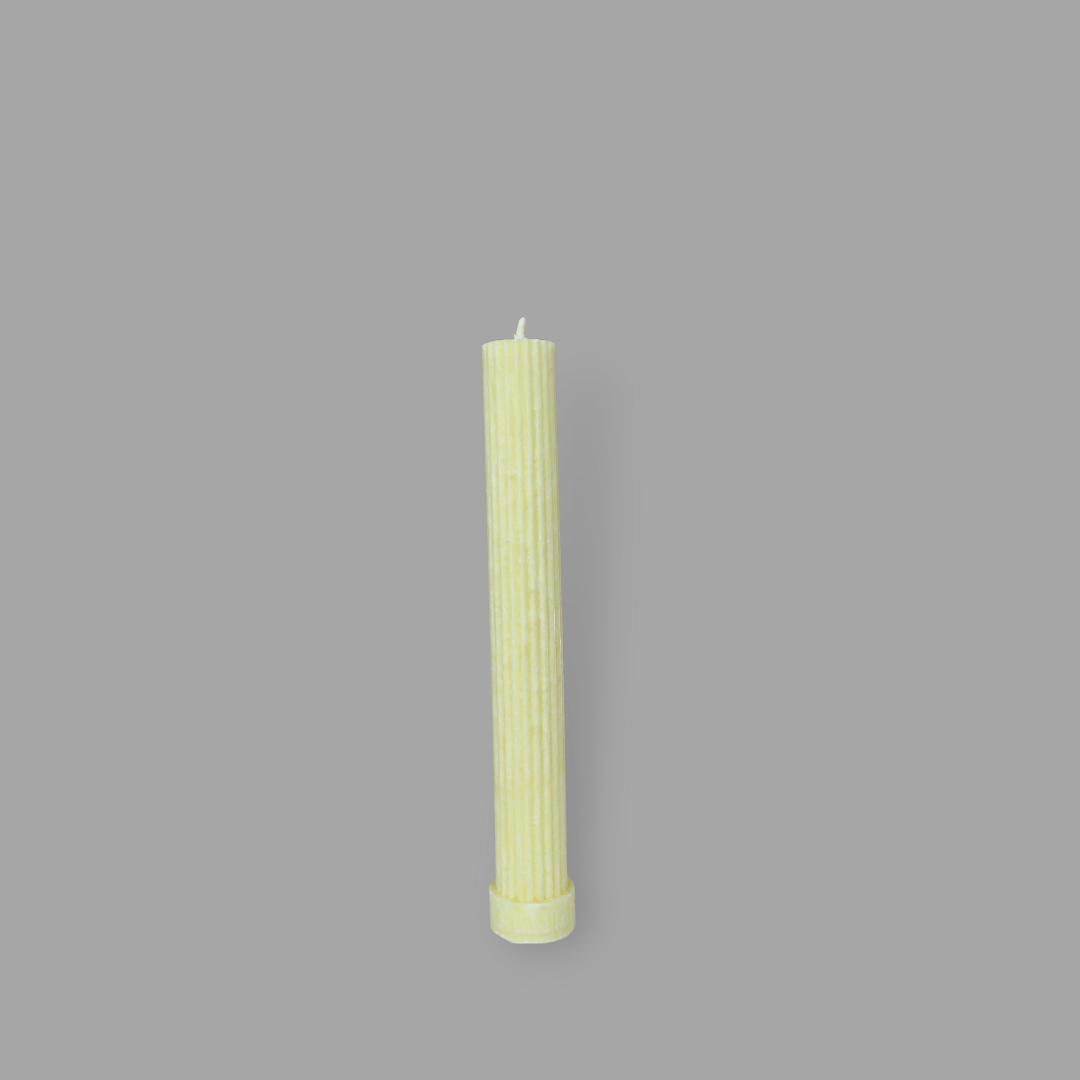 Allegra fluted pillar candle in 20cm height and flat base shown in frangipani (yellow) colour. 