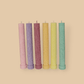 Allegra fluted pillar candle in 22cm height and flat base shown in six bright pastel colours.