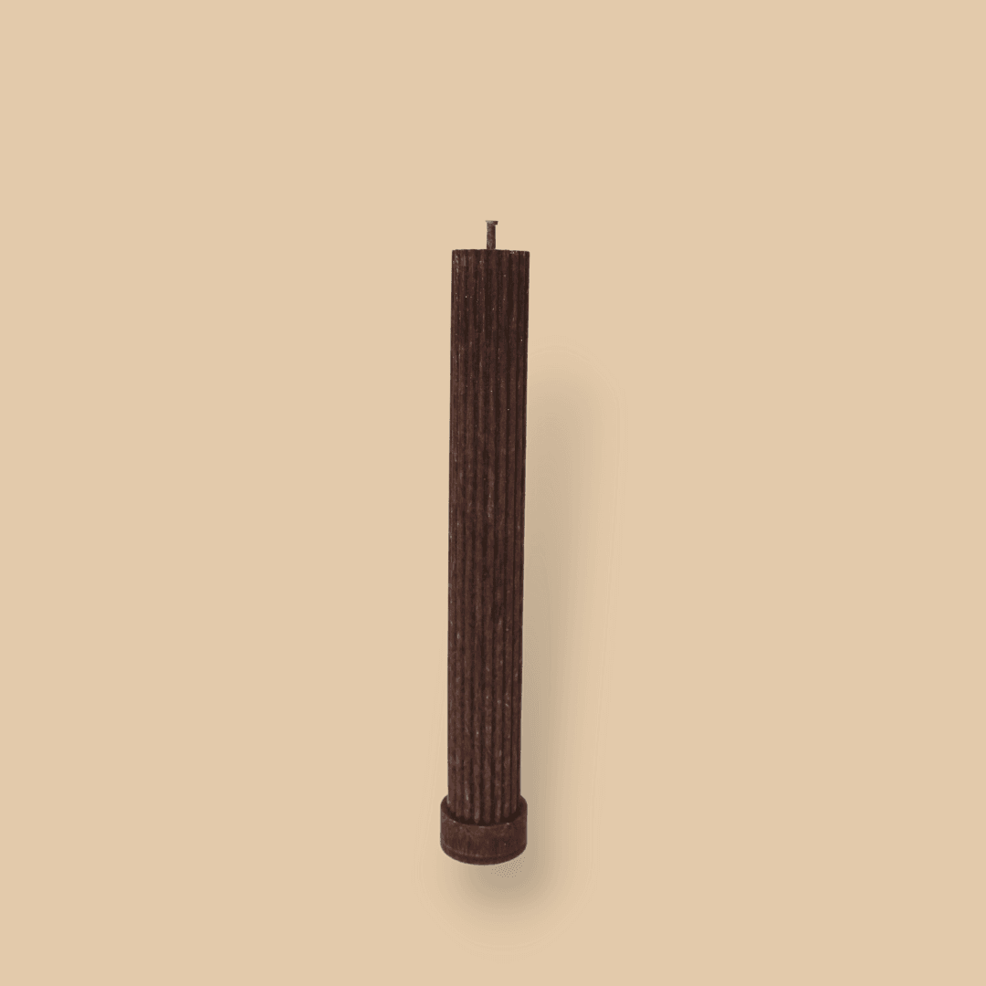 Allegra fluted pillar candle in 22cm height and flat base shown in Cacao (chocolate brown) colour.