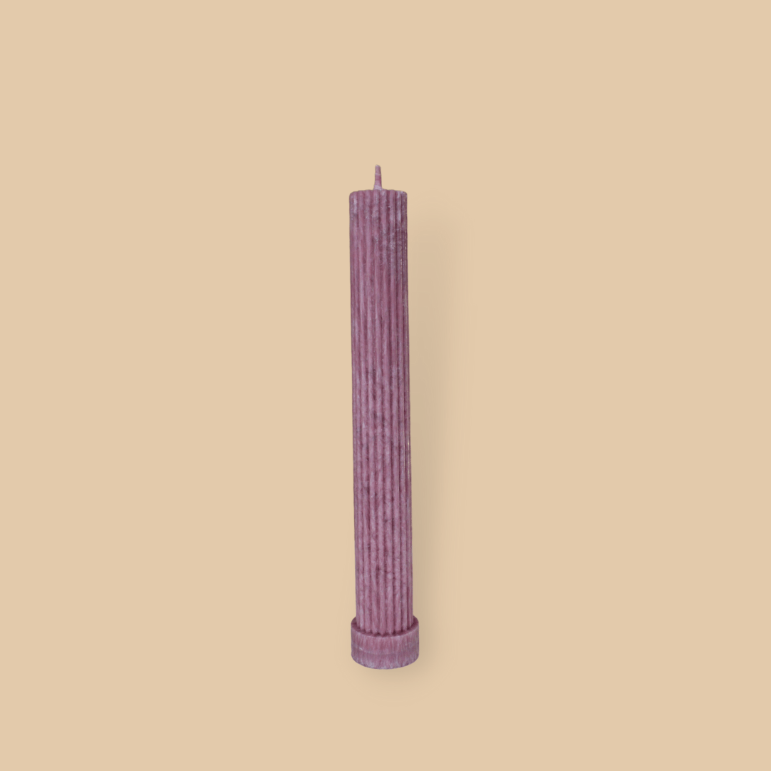 Allegra fluted pillar candle in 22cm height and flat base shown in Calla (pastel cherry) colour.