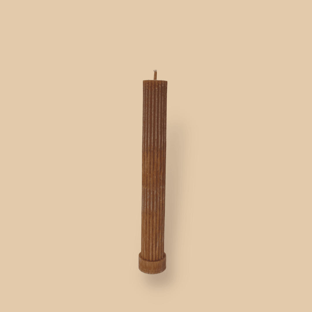 Allegra fluted pillar candle in 22cm height and flat base shown in Caramel colour.