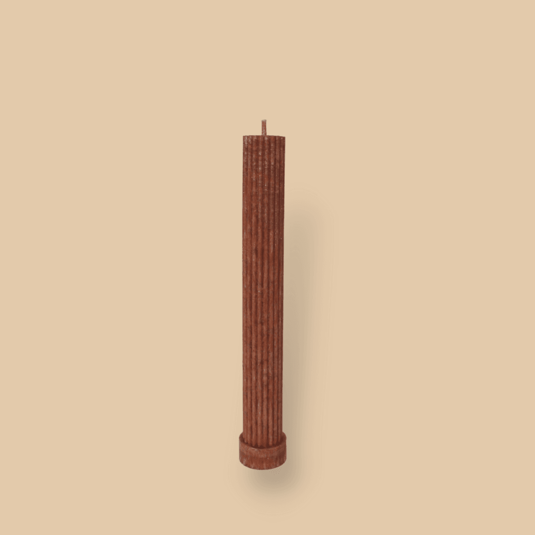 Allegra fluted pillar candle in 22cm height and flat base shown in Rust (burnt orange) colour.