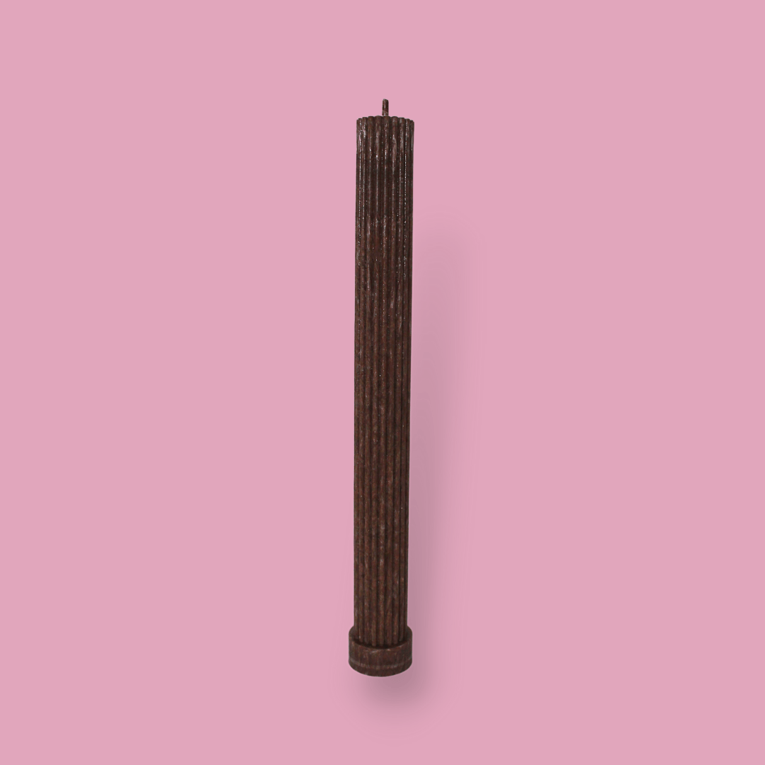 Allegra fluted pillar candle in 27cm height and flat base shown in Cacao (chocolate brown) colour.