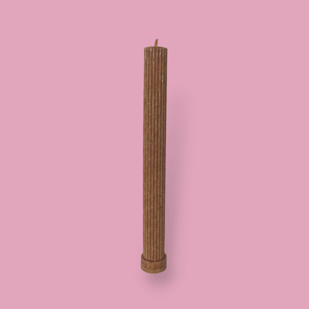 Allegra fluted pillar candle in 27cm height and flat base shown in Caramel colour.