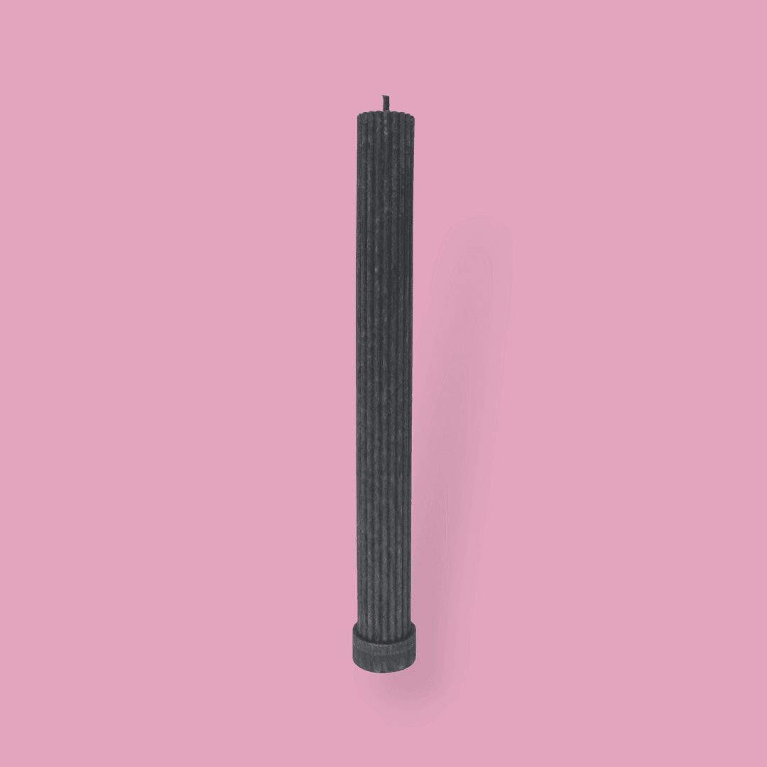 Allegra fluted pillar candle in 27cm height and flat base shown in New Moon (charcoal grey) colour.