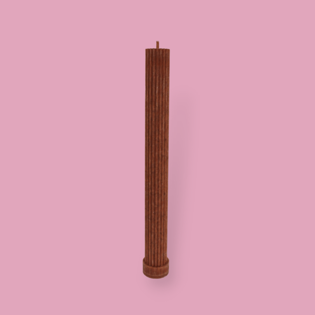 Allegra fluted pillar candle in 27cm height and flat base shown in Rust (burnt orange) colour.