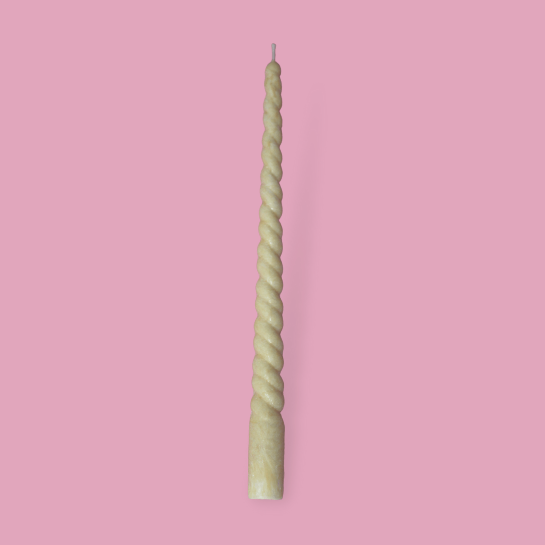 Twisty Ariel taper candle in Marigold (pastel orange) colour.