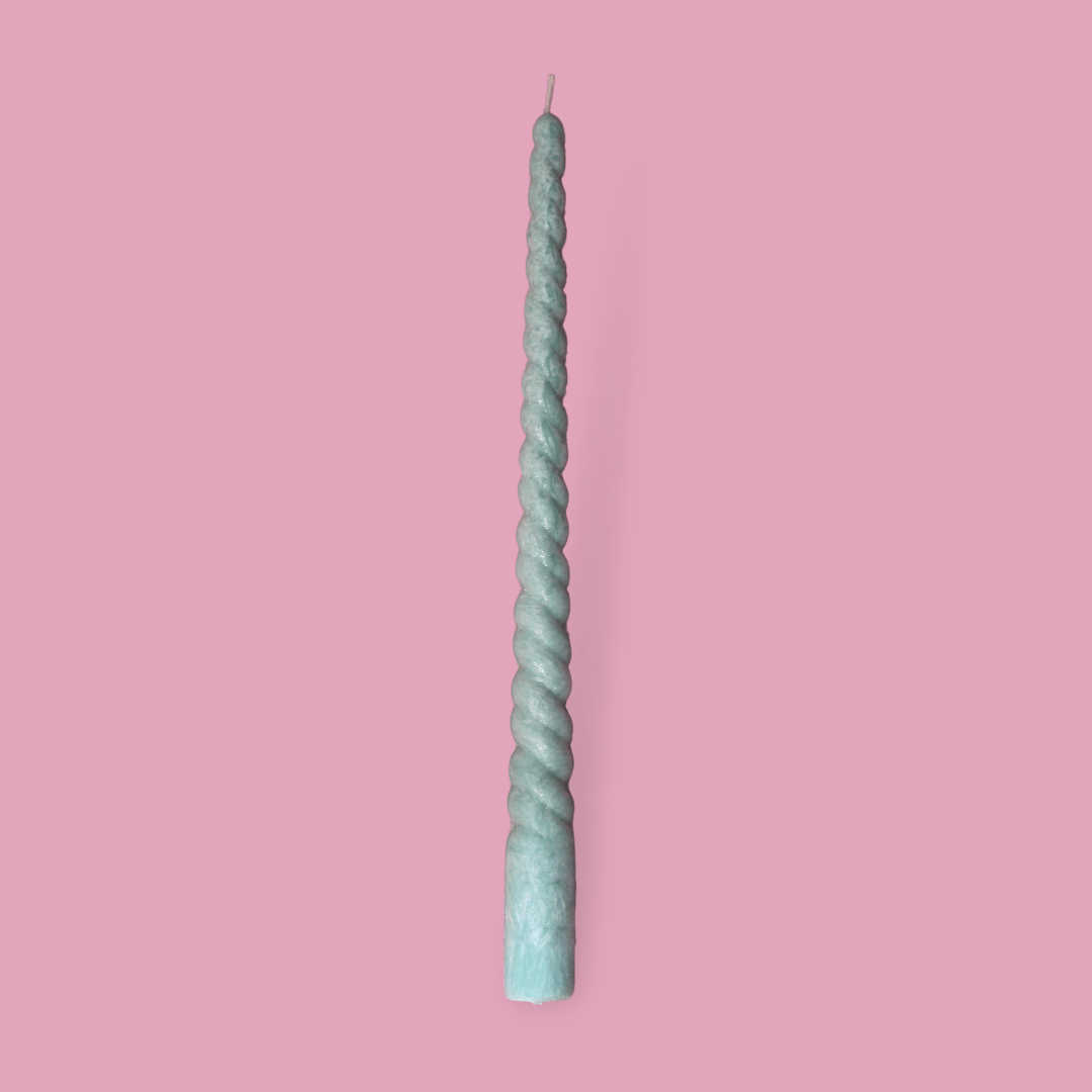 Twisty Ariel taper candle in Bud (pastel green) colour.