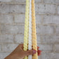 Twisty Ariel taper candles in Frangipani (yellow), Ivory (white) and Marigold (orange) shown together.