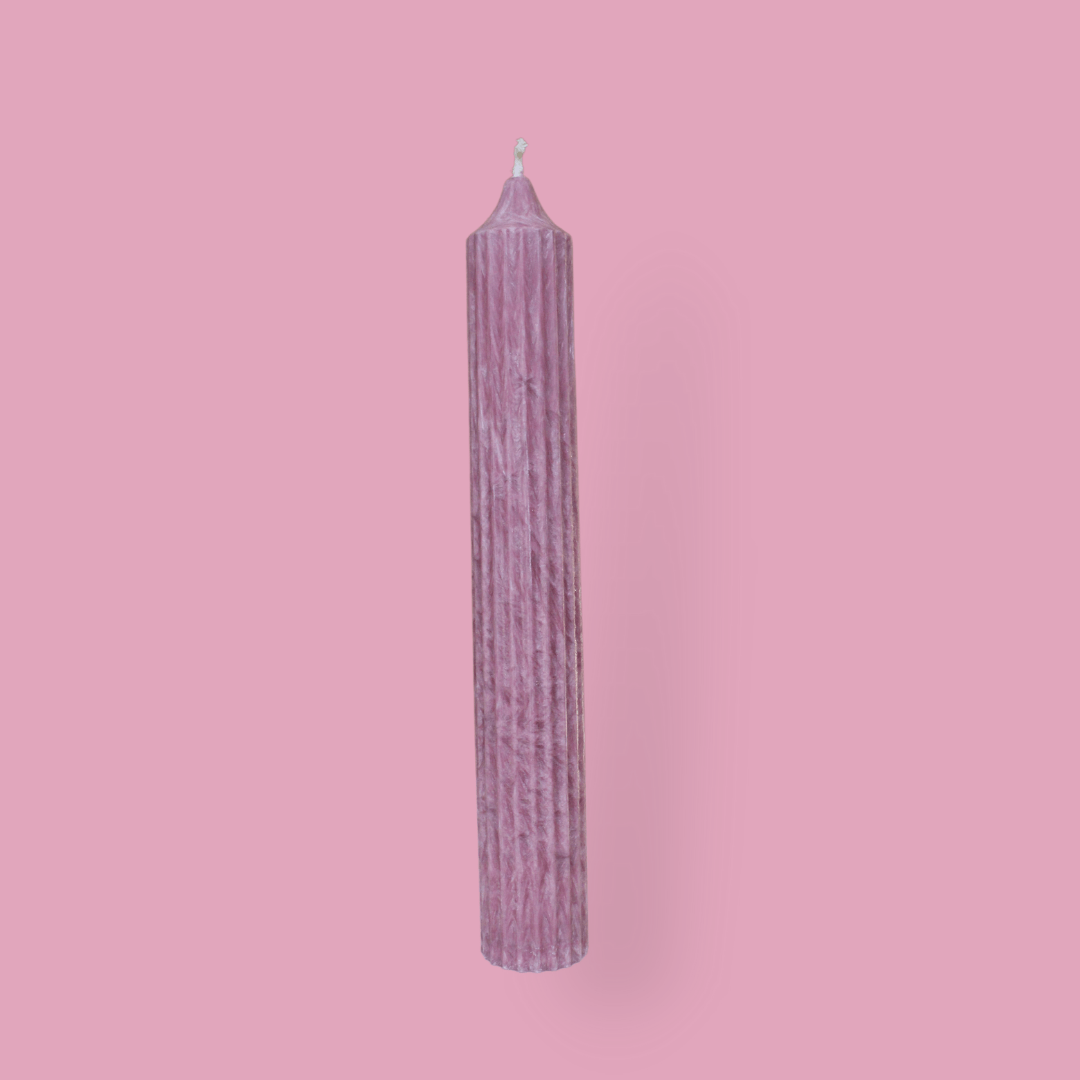 Tall pillar candle with a pointed top Elia in Calla (pastel cherry) colour.