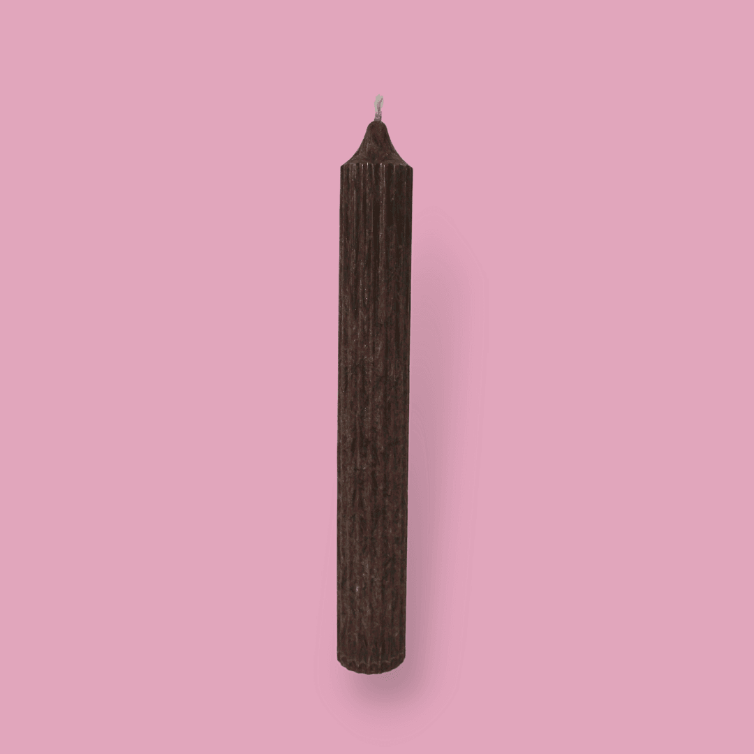 Tall pillar candle with a pointed top Elia in Cacao (chocolate brown) colour.