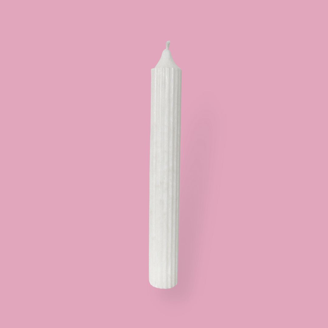 Tall pillar candle with a pointed top Elia in Ivory (white) colour.