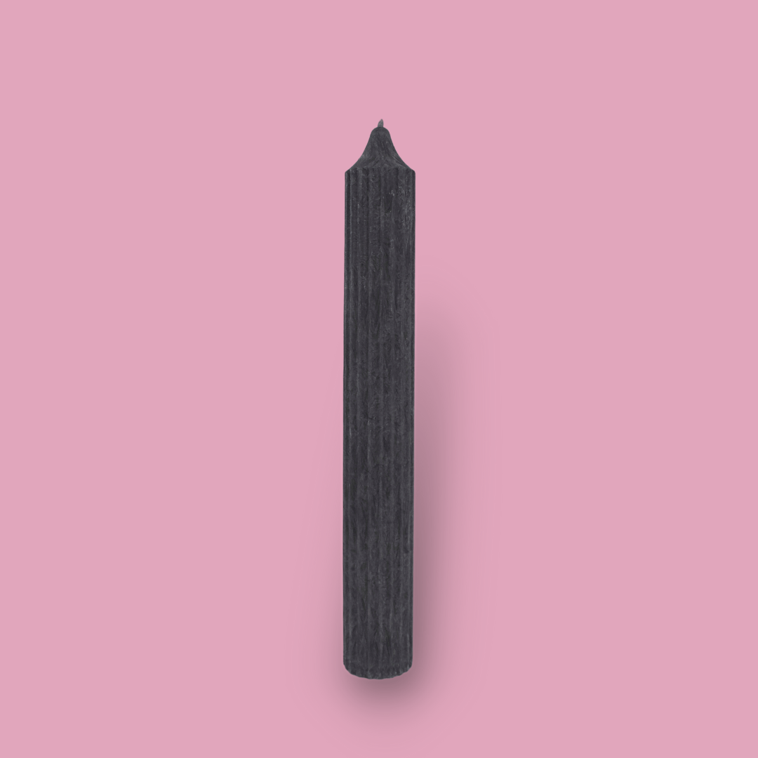 Tall pillar candle with a pointed top Elia in New Moon (charcoal grey) colour.