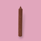 Tall pillar candle with a pointed top Elia in Rust (burnt orange) colour.