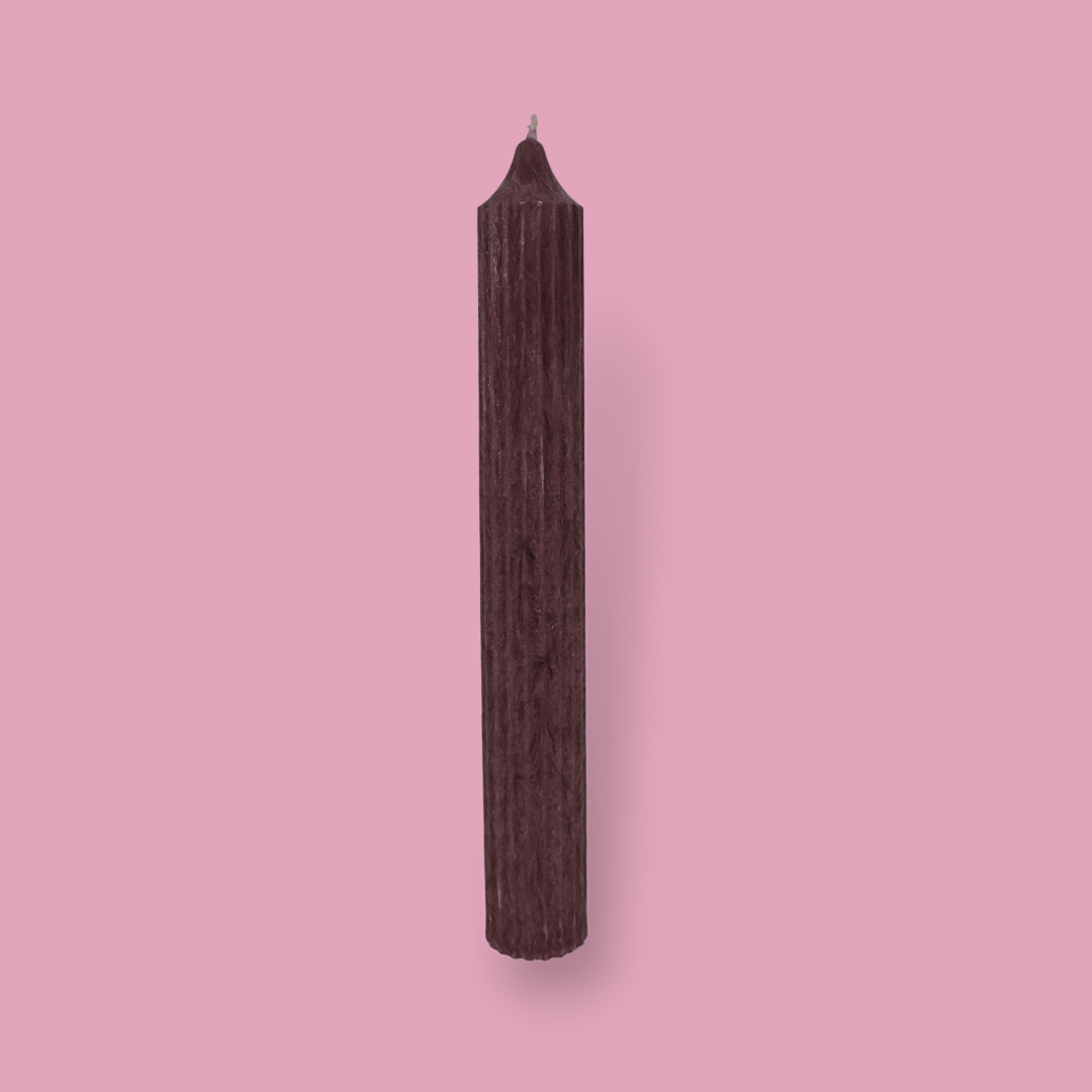 Tall pillar candle with a pointed top Elia in Viola (cherry) colour.