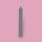 Tall pillar candle with a pointed top Elia in Half Moon (light grey) colour.