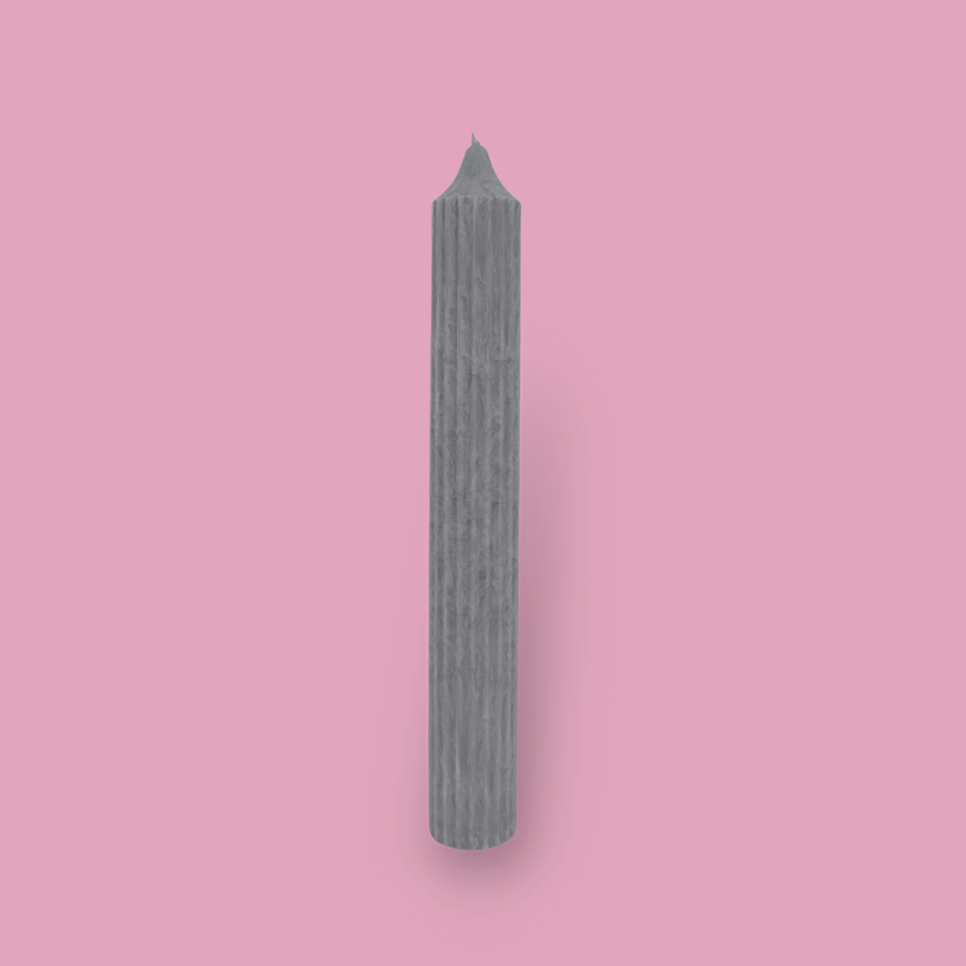 Tall pillar candle with a pointed top Elia in Half Moon (light grey) colour.