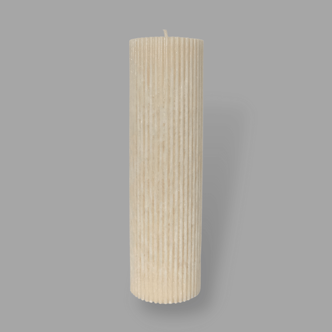 Tall thick fluted pillar candle Kaitlyn in White Onyx (warm cream) colour. This standalone pillar candle has a flat top and base.