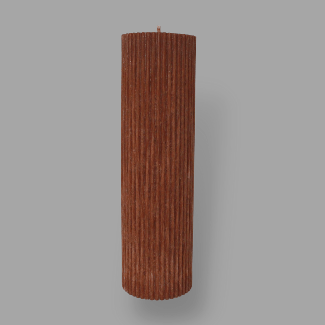 Tall thick fluted pillar candle Kaitlyn in Rust (burnt orange)colour. This standalone pillar candle has a flat top and base.