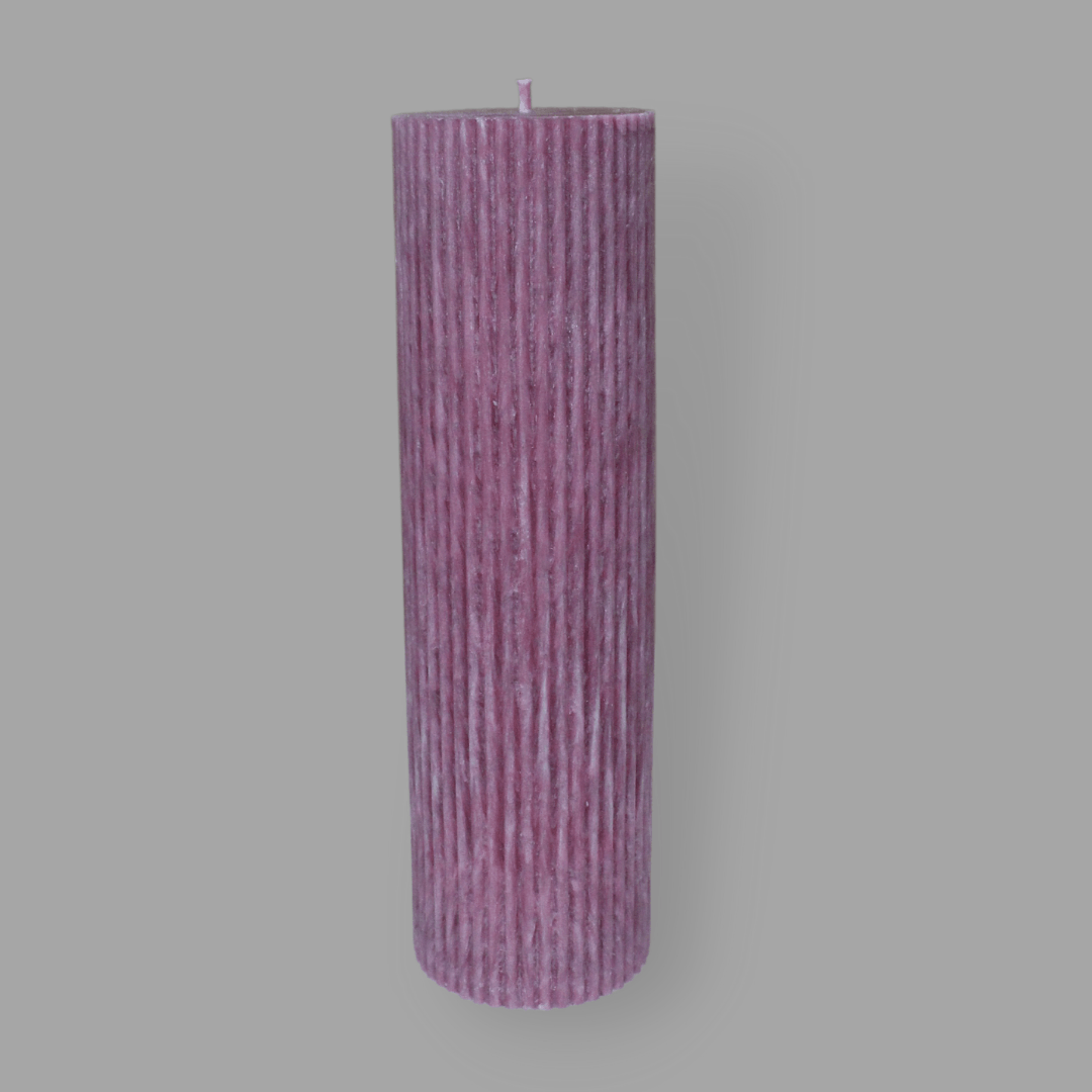 Tall thick fluted pillar candle Kaitlyn in Calla (pastel cherry) colour. This standalone pillar candle has a flat top and base.