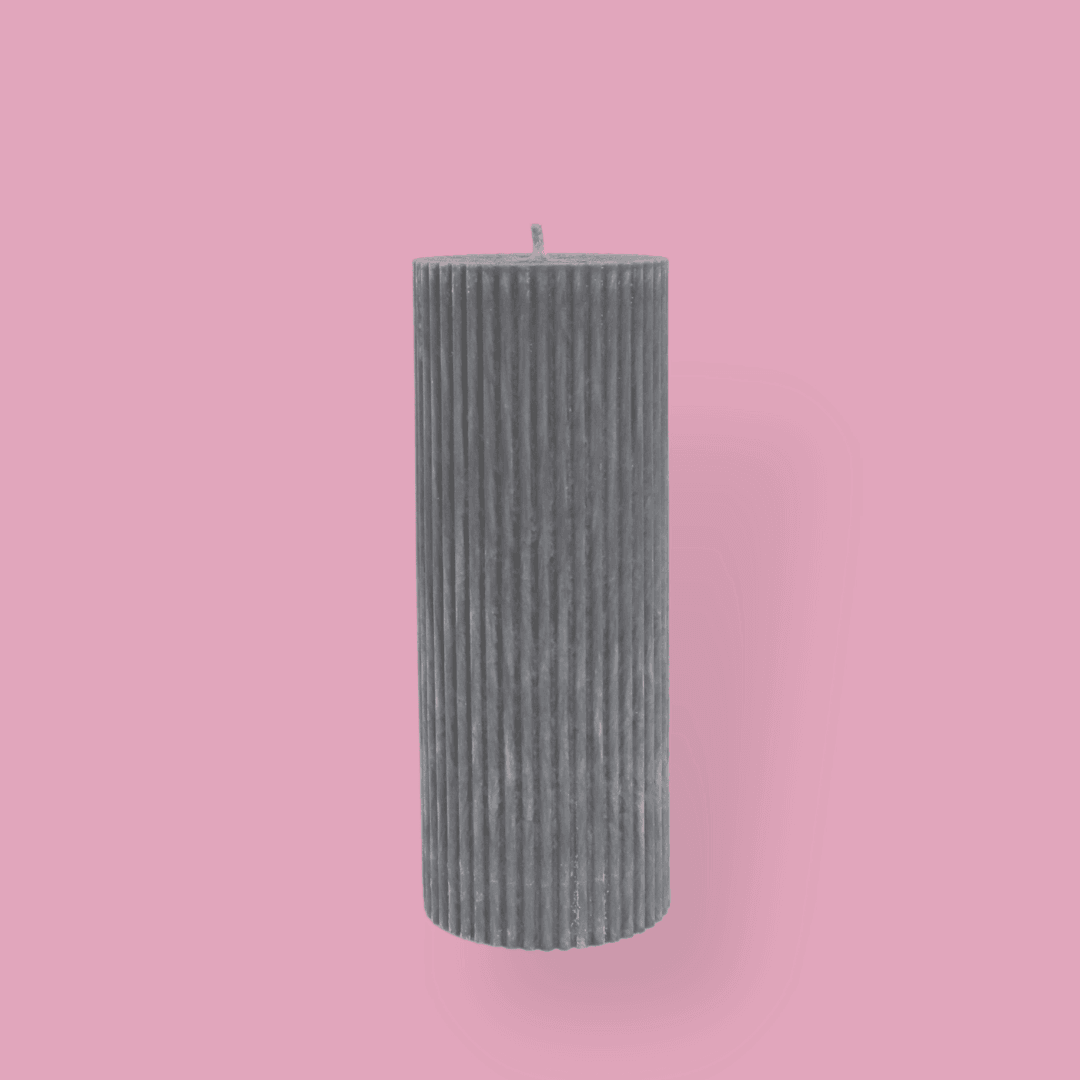 Medium height thick fluted pillar candle Marlie in Half Moon (light grey) colour. This standalone pillar candle has a flat top and base.