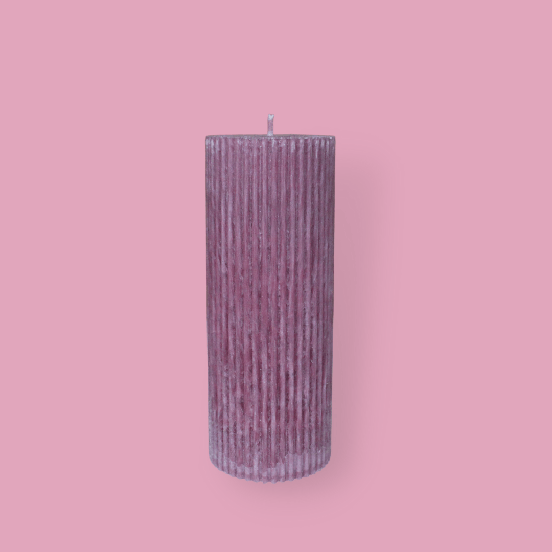 Medium height thick fluted pillar candle Marlie in Calla (pastel cherry) colour. This standalone pillar candle has a flat top and base.