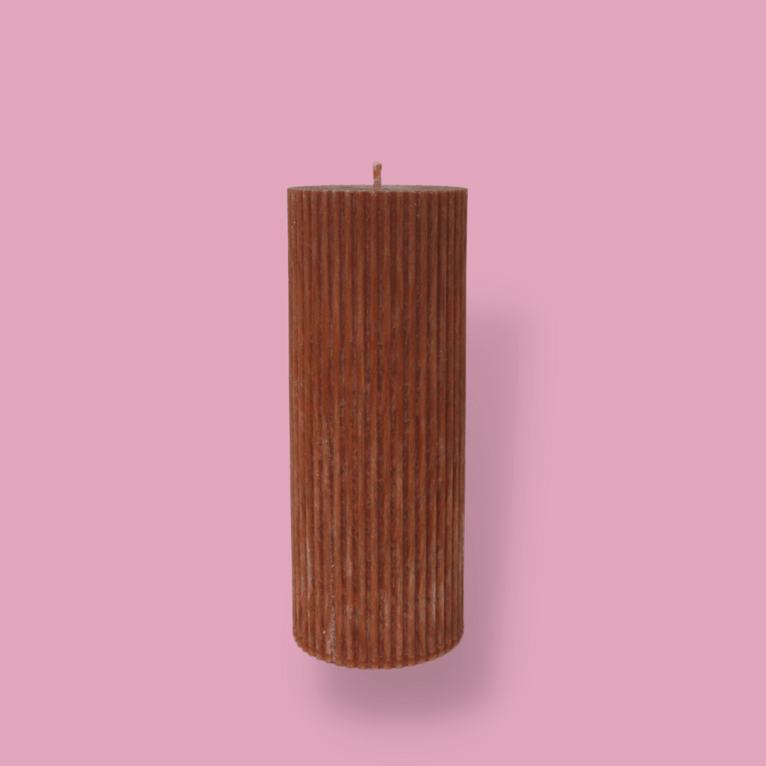 Medium height thick fluted pillar candle Marlie in Rust (burnt orange)colour. This standalone pillar candle has a flat top and base.