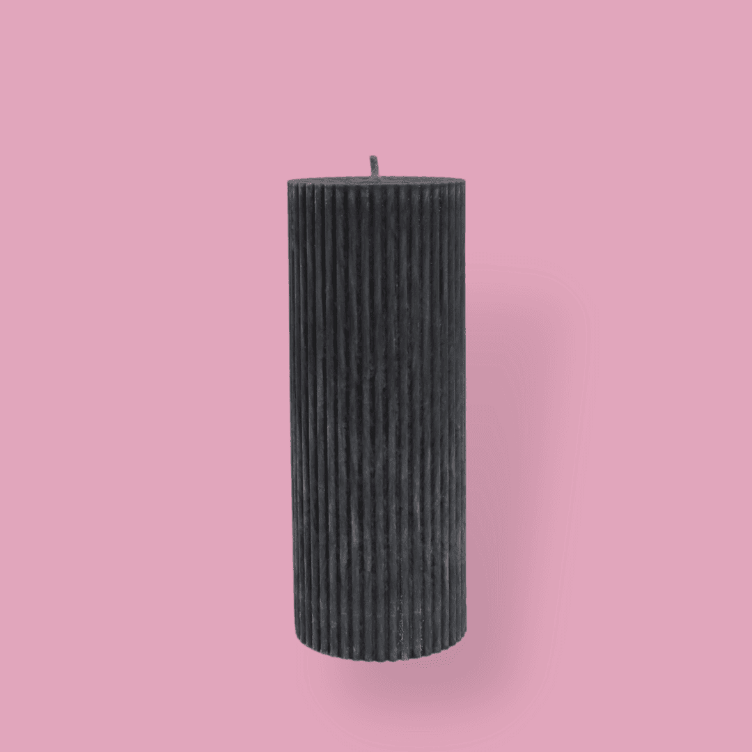 Medium height thick fluted pillar candle Marlie in New Moon (charcoal grey) colour. This standalone pillar candle has a flat top and base.