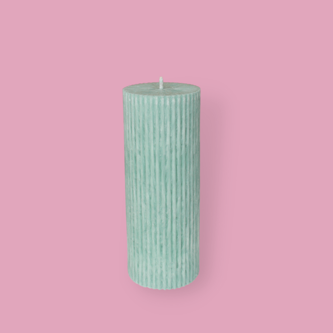 Medium height thick fluted pillar candle Marlie in Bud (pastel green) colour. This standalone pillar candle has a flat top and base.