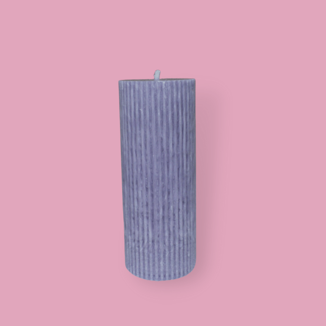 Medium height thick fluted pillar candle Marlie in Lavender (pastel purple) colour. This standalone pillar candle has a flat top and base.