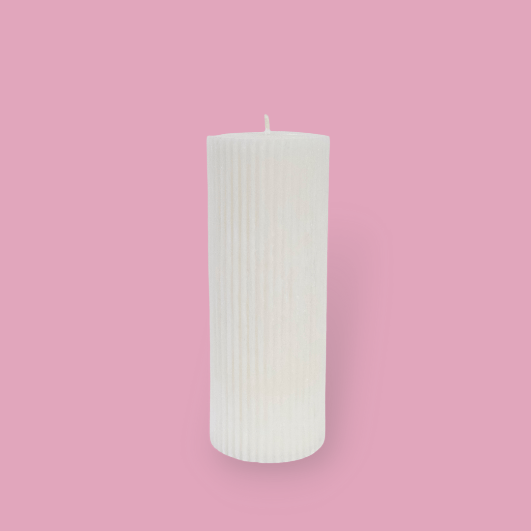 Medium height thick fluted pillar candle Marlie in Ivory (white) colour. This standalone pillar candle has a flat top and base.