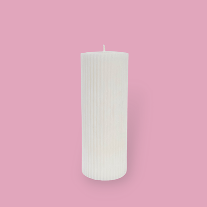 Medium height thick fluted pillar candle Marlie in Ivory (white) colour. This standalone pillar candle has a flat top and base.