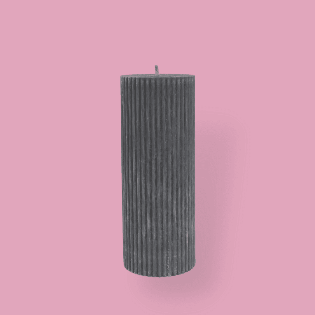 Medium height thick fluted pillar candle Marlie in Quarter Moon (medium grey) colour. This standalone pillar candle has a flat top and base.