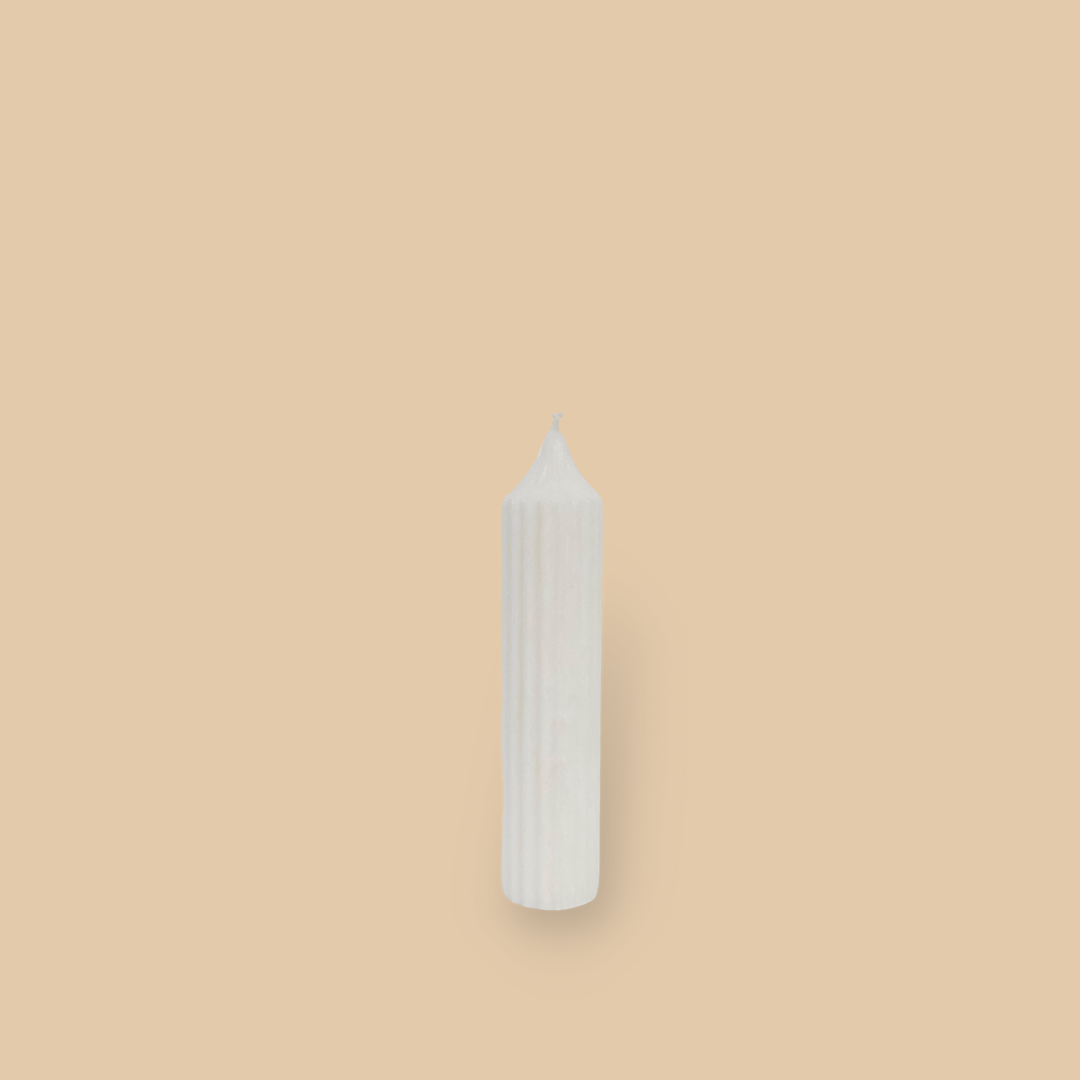 Pillar candle with a pointed top Mia in Ivory (white) colour.