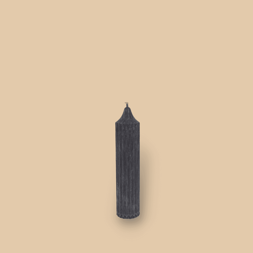 Pillar candle with a pointed top Mia in New Moon (charcoal grey) colour.