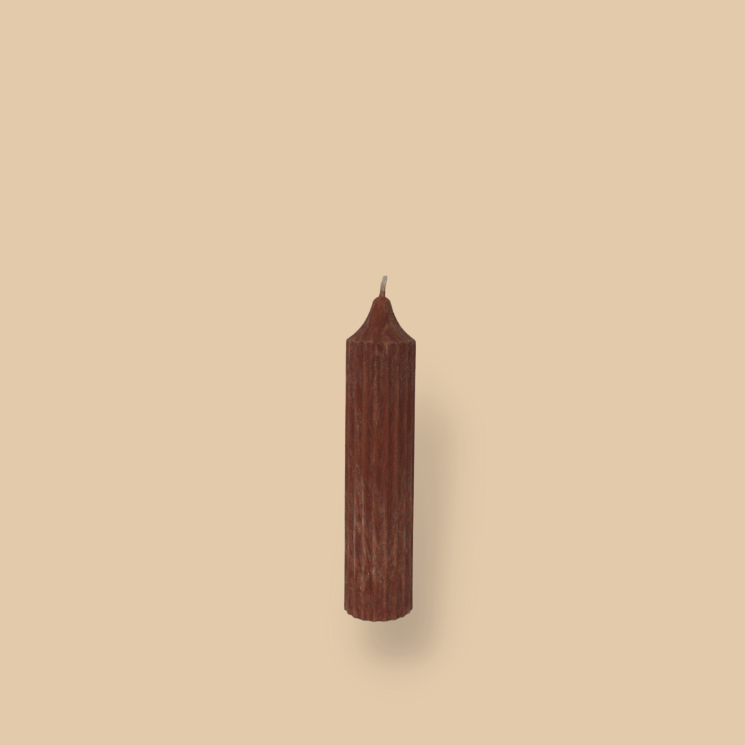 Pillar candle with a pointed top Mia in Rust (burnt orange) colour.