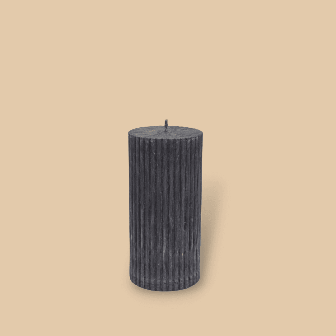 Short thick fluted pillar candle Sasha in New Moon (charcoal grey) colour. This standalone pillar candle has a flat top and base.