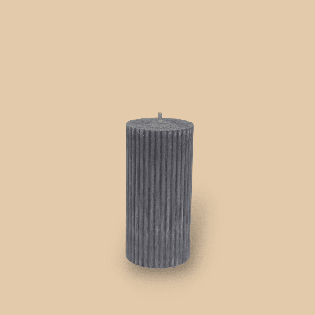 Short thick fluted pillar candle Sasha in Quarter Moon (medium grey) colour. This standalone pillar candle has a flat top and base.