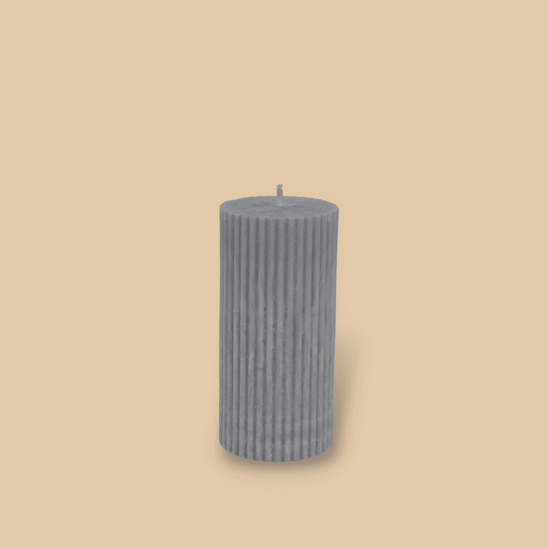 Short thick fluted pillar candle Sasha in Half Moon (light grey) colour. This standalone pillar candle has a flat top and base.