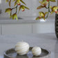 Spiral round floating candle spira in Ivory (white colour) shown in full size and mini size.