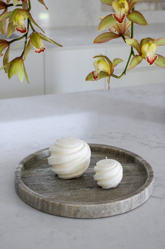 Spiral round floating candle spira shown in full and mini size in Ivory (white) colour.